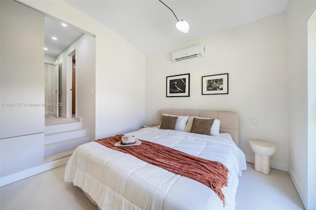 51 NE 110th St, Miami Shores, FL 33161 - bedroom featuring a wall mounted air conditioner, recessed lighting, and finished concrete flooring