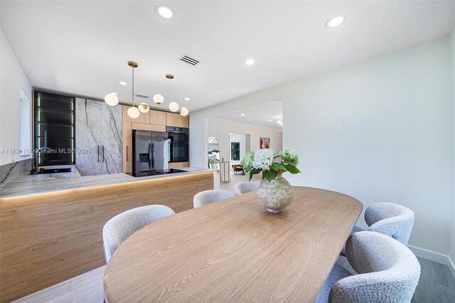 51 NE 110th St, Miami Shores, FL 33161 - dining room with recessed lighting and light wood-type flooring