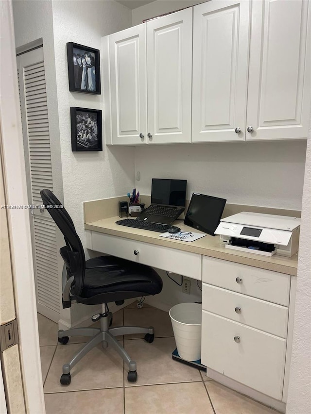 18861 SW 28th Ct, Miramar, FL 33029 - home office featuring light tile patterned flooring, built in study area, and a textured wall