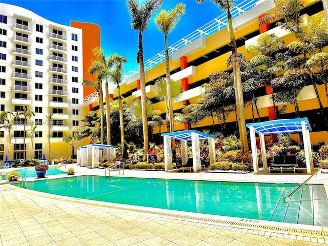 18800 NE 29th Ave Unit 412, Aventura, FL 33180 - community pool featuring a patio area