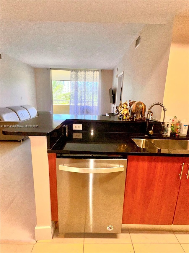 18800 NE 29th Ave Unit 412, Aventura, FL 33180 - kitchen with stainless steel dishwasher, open floor plan, light tile patterned flooring, and a textured ceiling