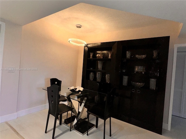 18800 NE 29th Ave Unit 412, Aventura, FL 33180 - dining area with baseboards and a heating unit