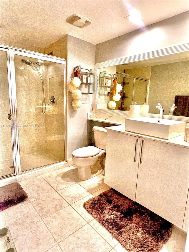 18800 NE 29th Ave Unit 412, Aventura, FL 33180 - bathroom with vanity, a stall shower, tile patterned flooring, and a textured ceiling