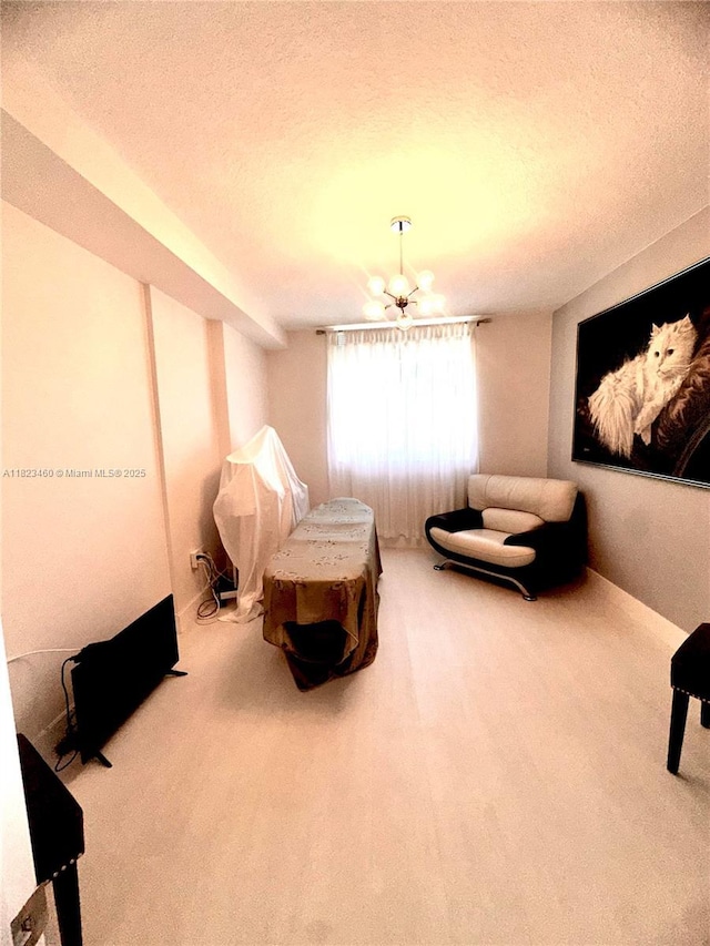 18800 NE 29th Ave Unit 412, Aventura, FL 33180 - living area featuring carpet flooring, a textured ceiling, and a chandelier