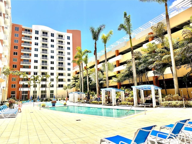 18800 NE 29th Ave Unit 412, Aventura, FL 33180 - community pool featuring a patio area