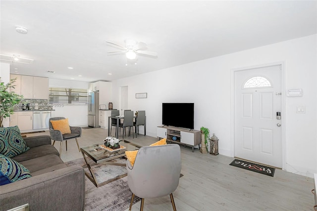 201 Columbus Pkwy, Hollywood, FL 33021 - living room with light wood-style floors, ceiling fan, and plenty of natural light