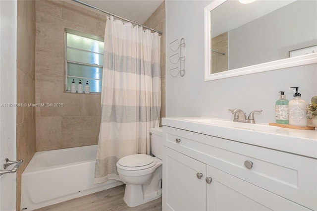 201 Columbus Pkwy, Hollywood, FL 33021 - bathroom featuring wood finished floors, vanity, and shower / bath combo with shower curtain