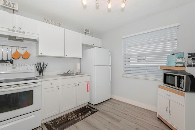 201 Columbus Pkwy, Hollywood, FL 33021 - kitchen featuring white appliances, under cabinet range hood, light wood finished floors, white cabinetry, and light countertops
