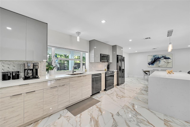 kitchen with modern cabinets, appliances with stainless steel finishes, gray cabinetry, backsplash, and light countertops