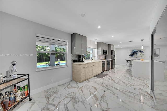 kitchen featuring black appliances, gray cabinetry, modern cabinets, light countertops, and recessed lighting