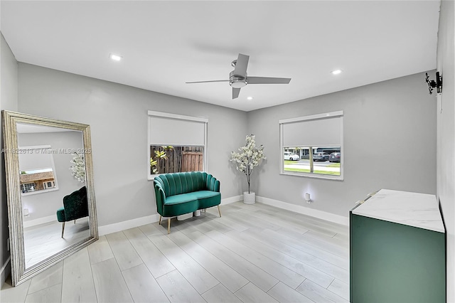 sitting room featuring ceiling fan, recessed lighting, and light wood finished floors