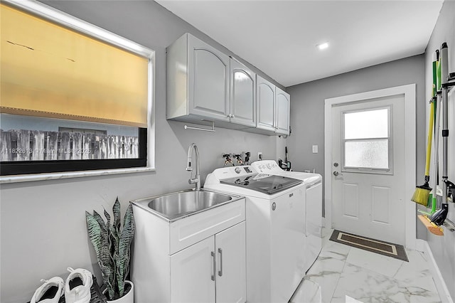7481 NW 14th St, Plantation, FL 33313 - laundry area featuring separate washer and dryer, cabinet space, and light marble finish flooring