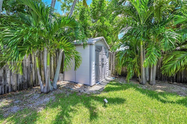 view of shed with a fenced backyard