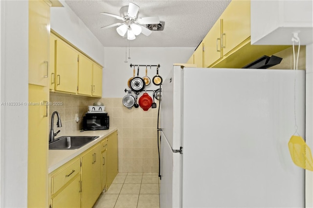 1030 SW 11th St Unit 8M, Hallandale Beach, FL 33009 - kitchen featuring freestanding refrigerator, a ceiling fan, light countertops, light tile patterned flooring, and a textured ceiling