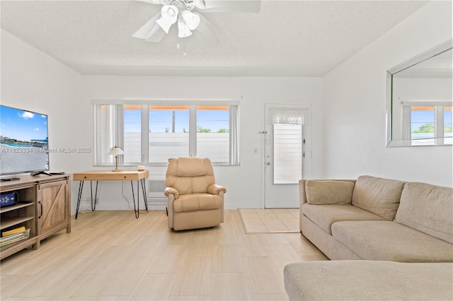1030 SW 11th St Unit 8M, Hallandale Beach, FL 33009 - living area with a ceiling fan and a textured ceiling