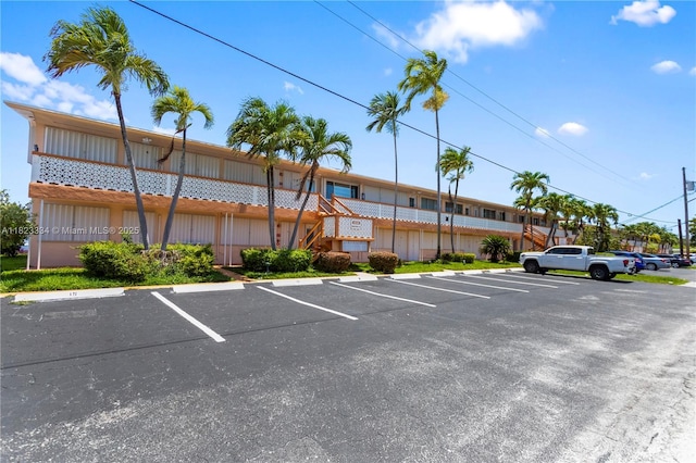 1030 SW 11th St Unit 8M, Hallandale Beach, FL 33009 - uncovered parking lot featuring stairway