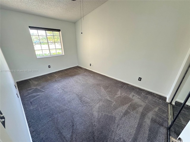 8135 Southgate Blvd, North Lauderdale, FL 33068 - empty room with a textured ceiling and dark colored carpet
