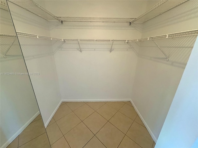 8135 Southgate Blvd, North Lauderdale, FL 33068 - walk in closet with light tile patterned floors