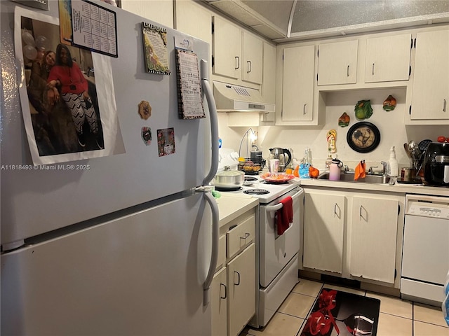 4160 Inverrary Dr Unit 306, Lauderhill, FL 33319 - kitchen featuring white appliances, under cabinet range hood, light tile patterned floors, and light countertops