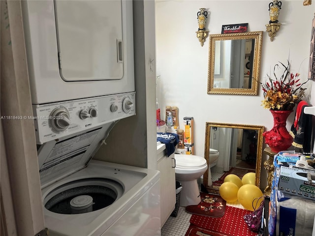 4160 Inverrary Dr Unit 306, Lauderhill, FL 33319 - washroom featuring stacked washer and clothes dryer and tile patterned flooring