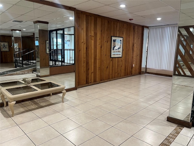 4160 Inverrary Dr Unit 306, Lauderhill, FL 33319 - building lobby featuring wooden walls, a drop ceiling, stairs, and recessed lighting