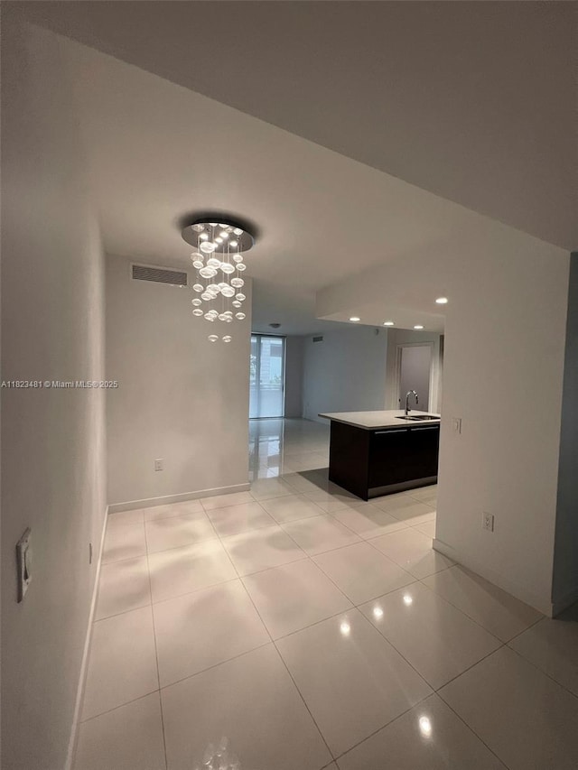 7661 NW 107th Ave Unit 207, Doral, FL 33178 - unfurnished room featuring light tile patterned floors, recessed lighting, and a chandelier