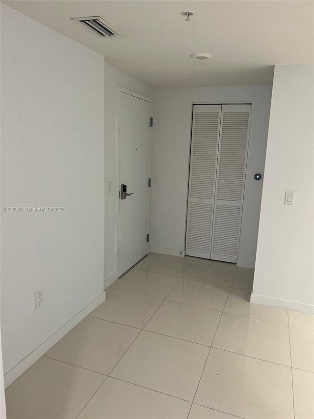 7661 NW 107th Ave Unit 207, Doral, FL 33178 - spare room featuring light tile patterned floors and a pendent fire sprinkler