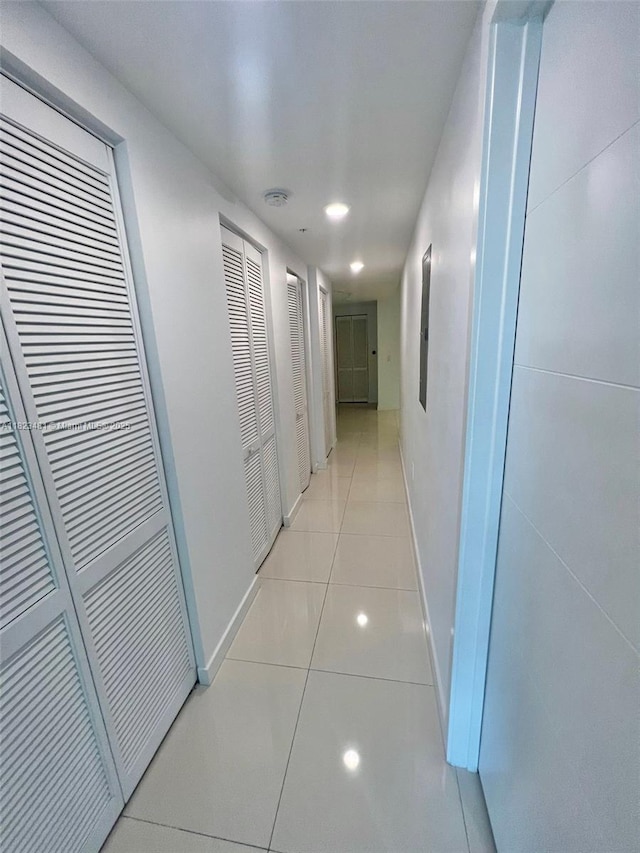 7661 NW 107th Ave Unit 207, Doral, FL 33178 - hallway featuring light tile patterned floors and recessed lighting