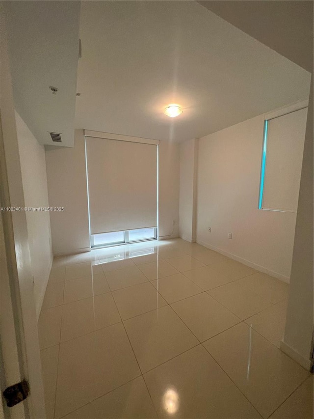 7661 NW 107th Ave Unit 207, Doral, FL 33178 - empty room with tile patterned flooring