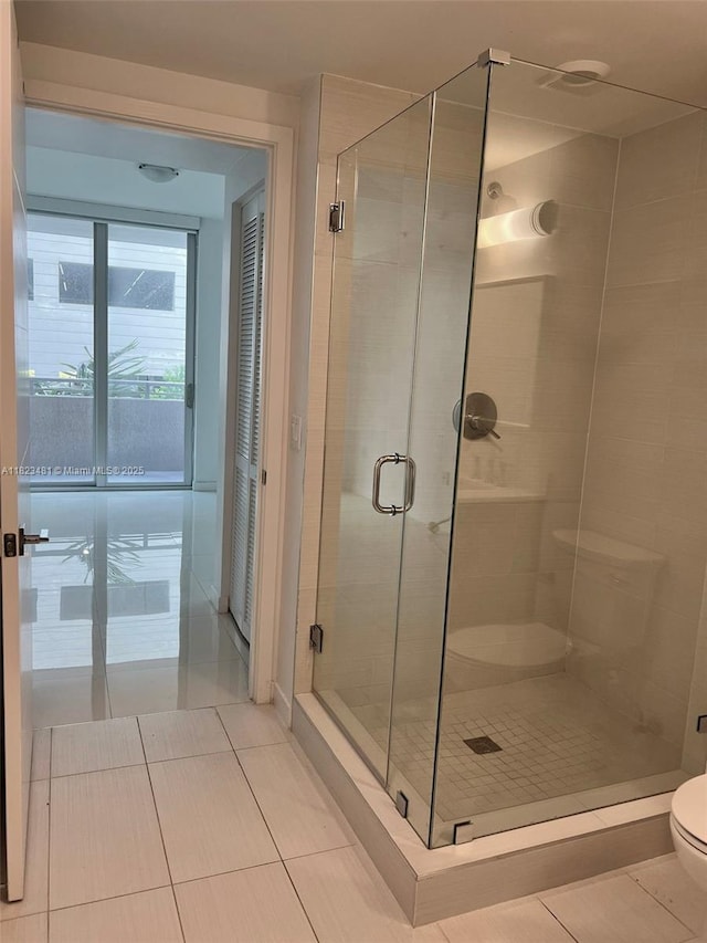 7661 NW 107th Ave Unit 207, Doral, FL 33178 - bathroom featuring tile patterned flooring and a shower stall