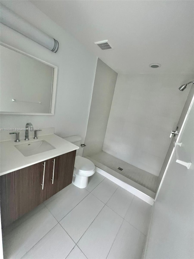 7661 NW 107th Ave Unit 207, Doral, FL 33178 - full bathroom featuring vanity, a tile shower, and tile patterned floors