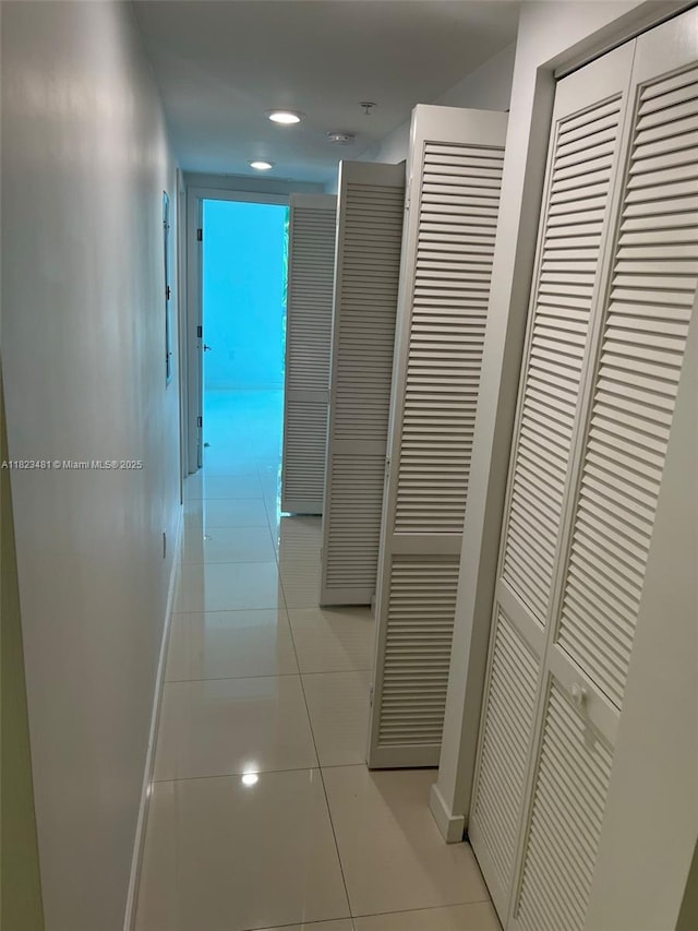 7661 NW 107th Ave Unit 207, Doral, FL 33178 - hall with light tile patterned floors and recessed lighting