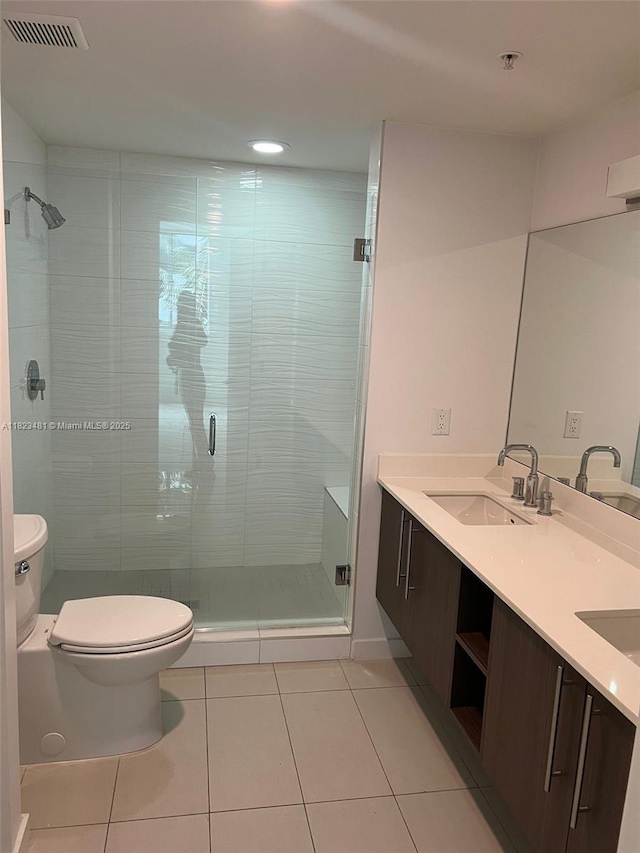 7661 NW 107th Ave Unit 207, Doral, FL 33178 - bathroom featuring tile patterned floors, double vanity, a shower stall, and recessed lighting
