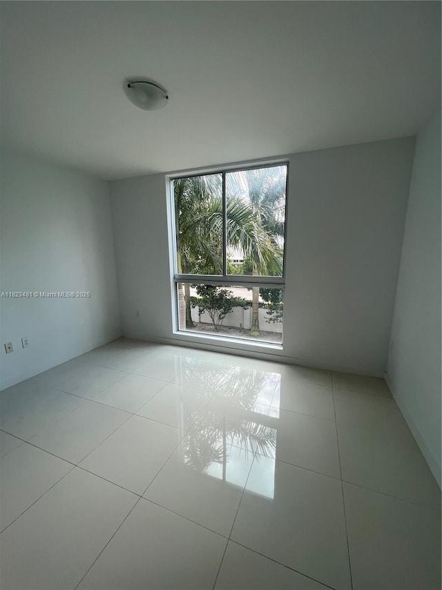 7661 NW 107th Ave Unit 207, Doral, FL 33178 - unfurnished room with tile patterned flooring