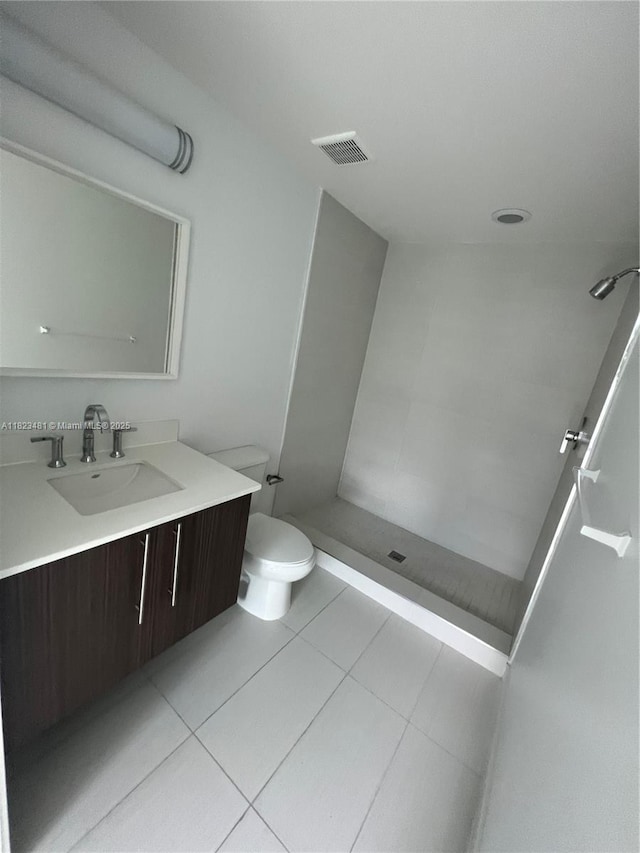 7661 NW 107th Ave Unit 207, Doral, FL 33178 - full bathroom with vanity, a shower stall, and tile patterned floors