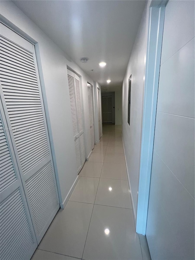 7661 NW 107th Ave Unit 207, Doral, FL 33178 - hall with light tile patterned floors and recessed lighting