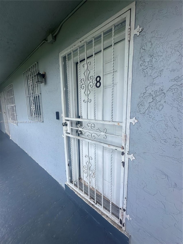 4050 NW 135th St Unit 8-9, Opa-Locka, FL 33054 - property entrance with stucco siding