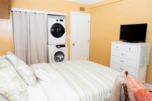 4050 NW 135th St Unit 8-9, Opa-Locka, FL 33054 - bedroom with stacked washer / drying machine