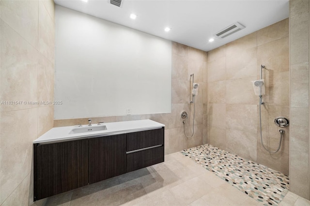 275 Giralda Ave Unit 6A-B, Coral Gables, FL 33134 - bathroom featuring a walk in shower, vanity, recessed lighting, and tile patterned floors