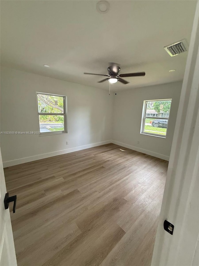9934 SW 195th St, Cutler Bay, FL 33157 - unfurnished room with plenty of natural light, wood finished floors, and ceiling fan