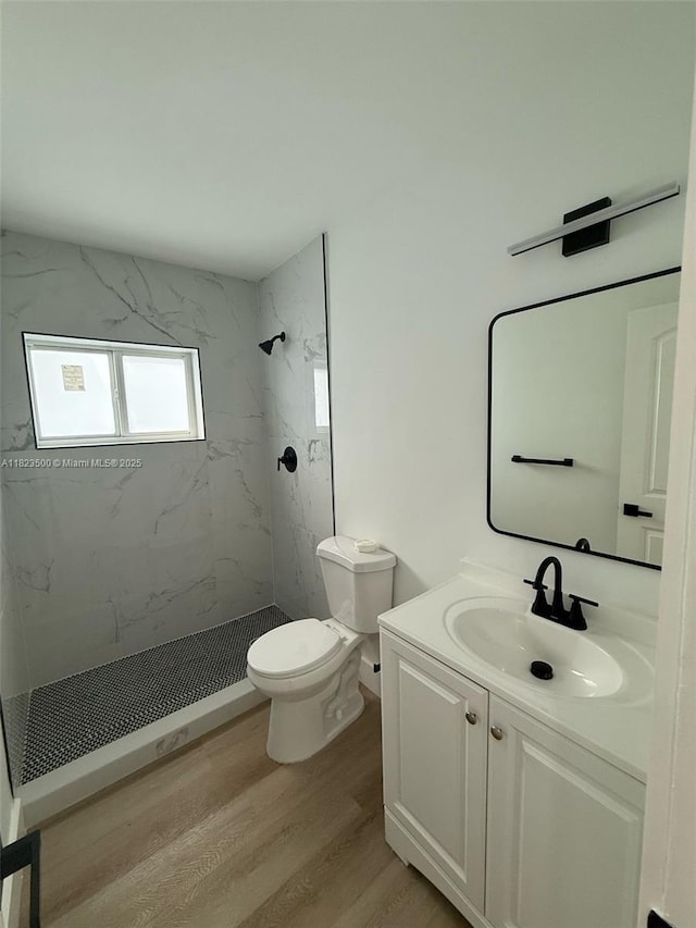 9934 SW 195th St, Cutler Bay, FL 33157 - bathroom with wood finished floors, a marble finish shower, and vanity