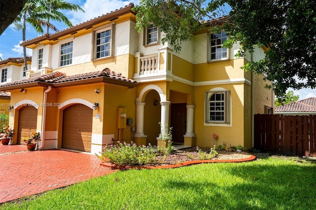 5000 SW 136th Ave, Miramar, FL 33027 - mediterranean / spanish home with a garage, stucco siding, a balcony, and decorative driveway