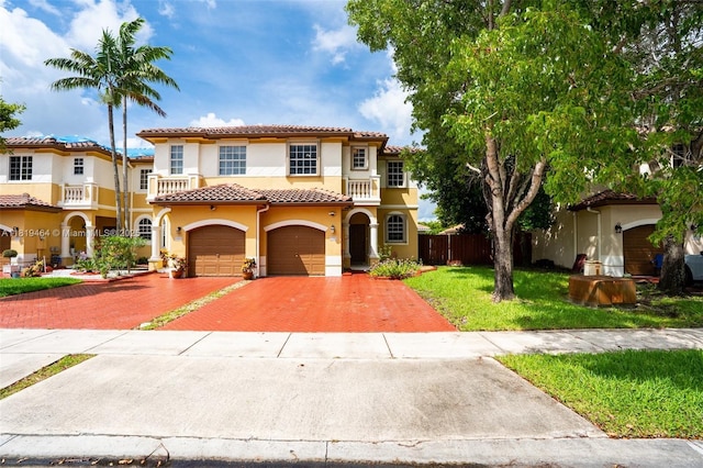 5000 SW 136th Ave, Miramar, FL 33027 - mediterranean / spanish-style home featuring stucco siding, decorative driveway, a tiled roof, and a garage