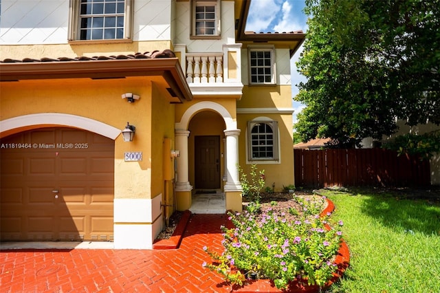 5000 SW 136th Ave, Miramar, FL 33027 - view of front of home with stucco siding, a balcony, an attached garage, and a tile roof