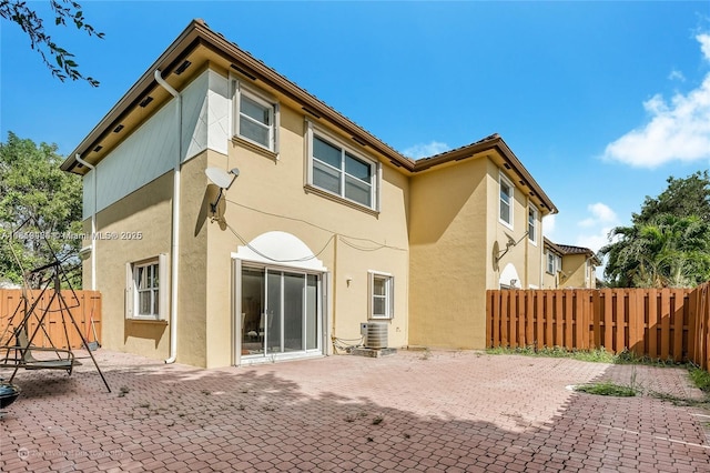 5000 SW 136th Ave, Miramar, FL 33027 - rear view of house with stucco siding and a patio