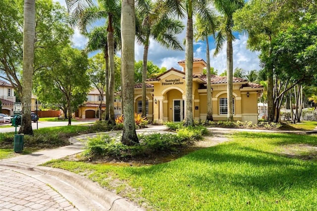 5000 SW 136th Ave, Miramar, FL 33027 - mediterranean / spanish home featuring stucco siding, a front lawn, and a tile roof
