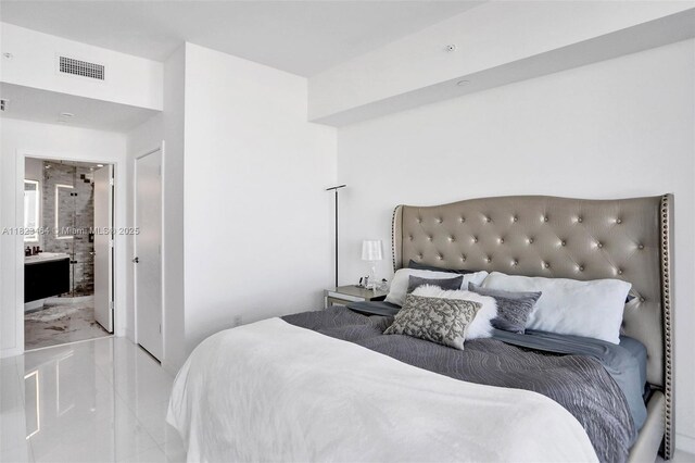 851 NE 1st Ave Unit 2204, Miami, FL 33132 - bedroom with ensuite bathroom and light marble finish flooring