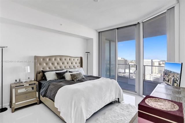 851 NE 1st Ave Unit 2204, Miami, FL 33132 - bedroom featuring access to outside, light tile patterned floors, a wall of windows, and a city view