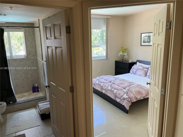 2000 N Bayshore Dr Unit 201, Miami, FL 33137 - bedroom featuring light tile patterned flooring and multiple windows