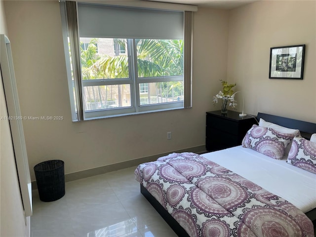 2000 N Bayshore Dr Unit 201, Miami, FL 33137 - bedroom with tile patterned flooring and baseboards